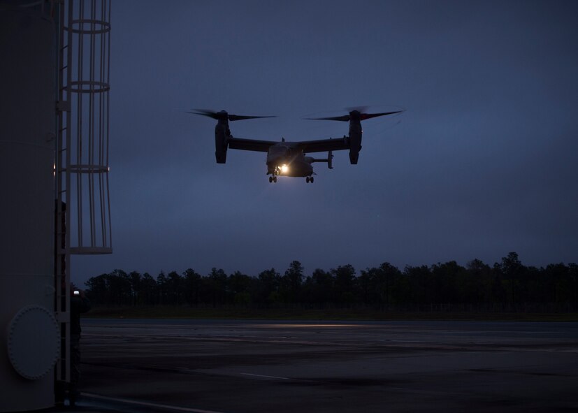 A CV-22 Osprey descends on the Landing Helicopter Deck at Duke Field, Fla., April 3, 2017. This was the first step in an effort to utilize the LHD as part of a pre-deployment requirement for CV-22 aircrew to be deck qualified. In previous years, members of the 8th Special Operations Squadron and 8th Aircraft Maintenance Unit would travel to various locations multiple times a year to gain aircraft carrier qualification. (U.S. Air Force photo by Senior Airman Krystal M. Garrett)