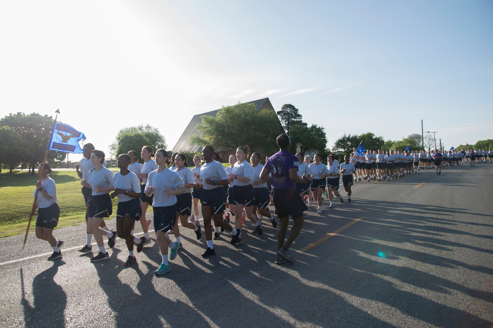 Trainees from the 324th Training Squadron run in formation during the squadron’s inaugural Knight’s Day 5K at the 324th TRS at Joint Base San Antonio-Lackland, Texas, March 25, 2017. Three trainees from each flight who exemplify the squadron’s motto of “ready for battle” represented their squadron and ran separately to compete for first place and flight pride. 