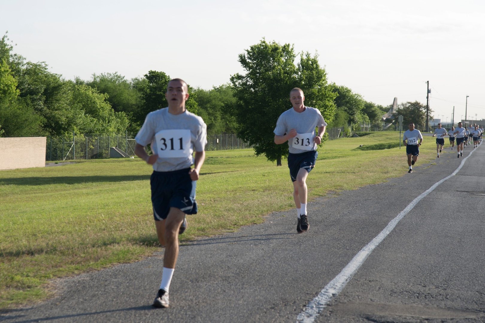 Air Force Basic Military trainees compete for first place during the 324th Training Squadron’s first 5K Run event at Joint Base San Antonio-Lackland, Texas, March 25, 2017. The 5K was held to increase morale amongst the trainees staff and honor March 24th as Knight’s Day, a day 324th TRS commander Lt. Col. Sammuel Berenguer designated to honor the legacy and lineage of the squadron. 