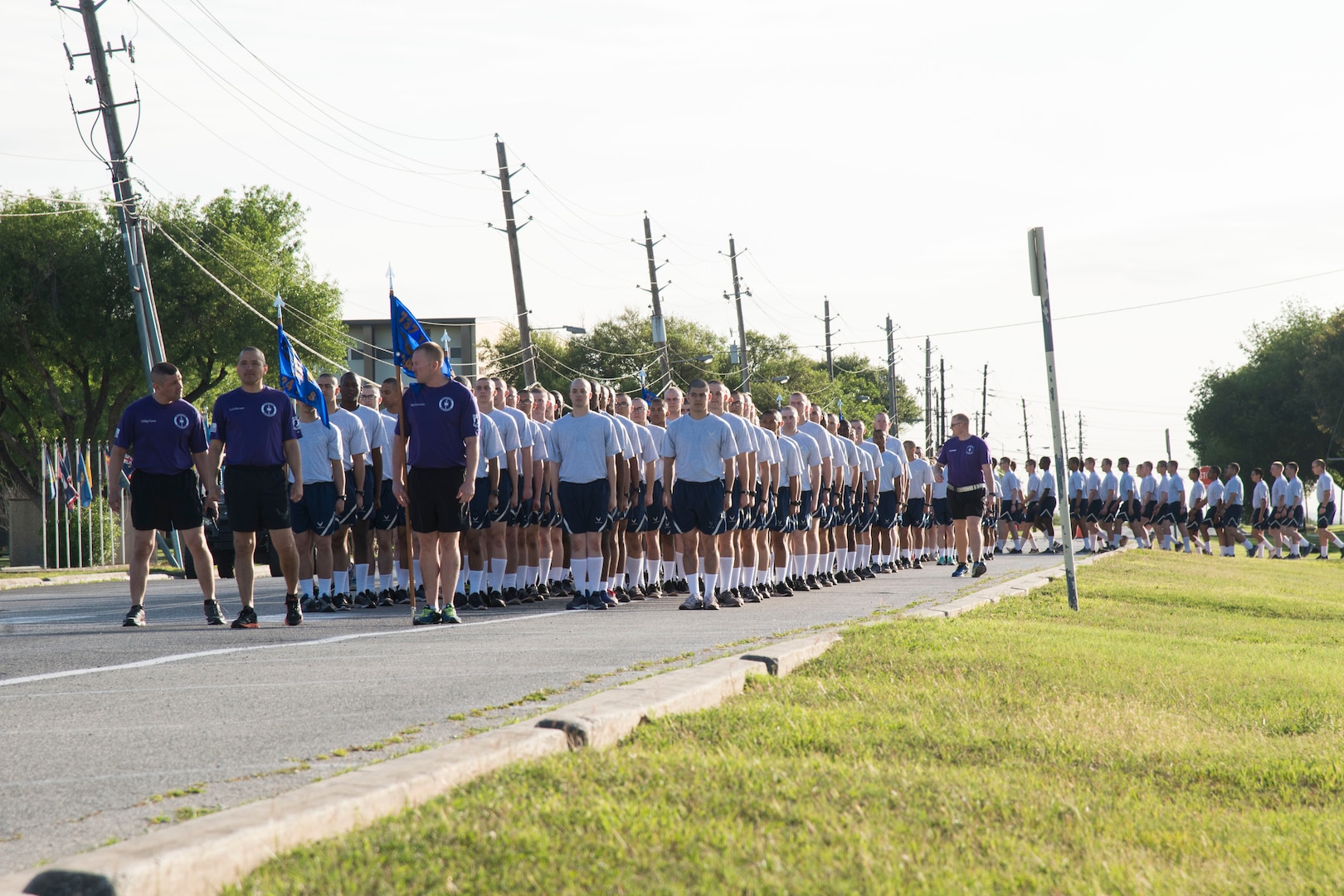 Lt. Col. Sammuel Berenguer, 324th Training Squadron commander, and Chief Master Sgt. Eric Gaona, 324th TRS superintendent, lead the squadron to the starting line for the Knights Day 5K on the 324th TRS physical training pad at Joint Base San Antonio-Lackland, Texas, March 25, 2017. The 5K run was the first hosted by a Basic Military Training Squadron. 
