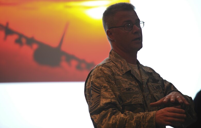 Chief Master Sgt. Gregory Smith, the command chief of Air Force Special Operations Command, speaks during the celebration of the 50th Anniversary of the AC-130 at Hurlburt Field, Fla., March 31, 2017. Smith spoke on the importance the gunship has on the battlefield and the importance of the aircraft’s evolution in achieving air superiority. (U.S. Air Force photo by Airman 1st Class Dennis Spain)