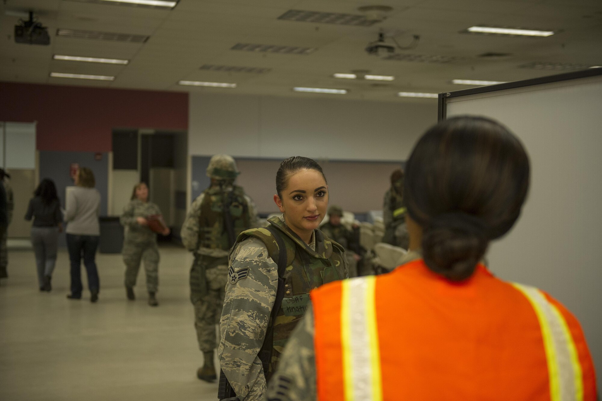 U.S. Air Force Senior Airman Emily Hnatiuk, a 354th Force Support Squadron sports director, speaks to a representative from food services April 4, 2017, at Eielson Air Force Base, Alaska. Food services along with several other base agencies was present during the simulated chalk lines to help provide a realistic experience for the participants of Arctic Gold 17-5. (U.S. Air Force photo by Airman 1st Class Isaac Johnson)