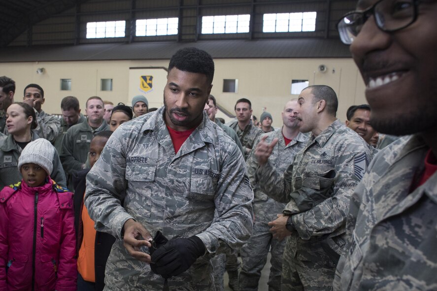 Senior Airman Quentin Gartrell, 374th Maintenance Group document specialist, prepares for the final chock hold competition during the annual 374th MXG Wrenchbender rodeo at Yokota Air Base, Japan, March 31, 2017. Yokota maintainers with the 374th Aircraft Maintenance Squadron, 374th Maintenance Squadron, 374th MXG, and 730th Air Mobility Squadron teamed up and participated in the rodeo which a variety of challenges: four-man pushups, leadership tool identification, maintenance relay race, Self Aid Buddy Care (SABC) timed event, vehicle push, towbar obstacle course, chock hold, blindfolded toolbox buildup, and a C-130H pull event. (U.S. Air Force photo by Yasuo Osakabe) 