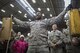 Senior Airman Quentin Gartrell, 374th Maintenance Group document specialsit, holds chocks up during the annual 374th MXG Wrenchbender rodeo chock hold competition at Yokota Air Base, Japan, March 31, 2017. Gartrell is one of the finalist of the competition. The chock hold competition challenged Airmen to endure holding chocks up longer than opposing teams. A chock is a wedge placed against a wheel to prevent an aircraft from movement. (U.S. Air Force photo by Yasuo Osakabe)