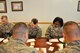 Lt. Col. Lashauna Lindsey, 341st Communications Squadron commander, compares notes with a fellow commander during a group activity at the 20th Air Force Senior Leader Conference on F.E. Warren Air Force Base, Wyo., March 30, 2017. Squadron commanders from across 20th AF who attended were able to share ideas and network during the event. The 20th AF SLC focused on revitalizing the squadron as a core fighting unit, a major focus area of Gen. David L. Goldfein, Air Force Chief of Staff.  (U.S. Air Force photo 1st Lt Veronica Perez)