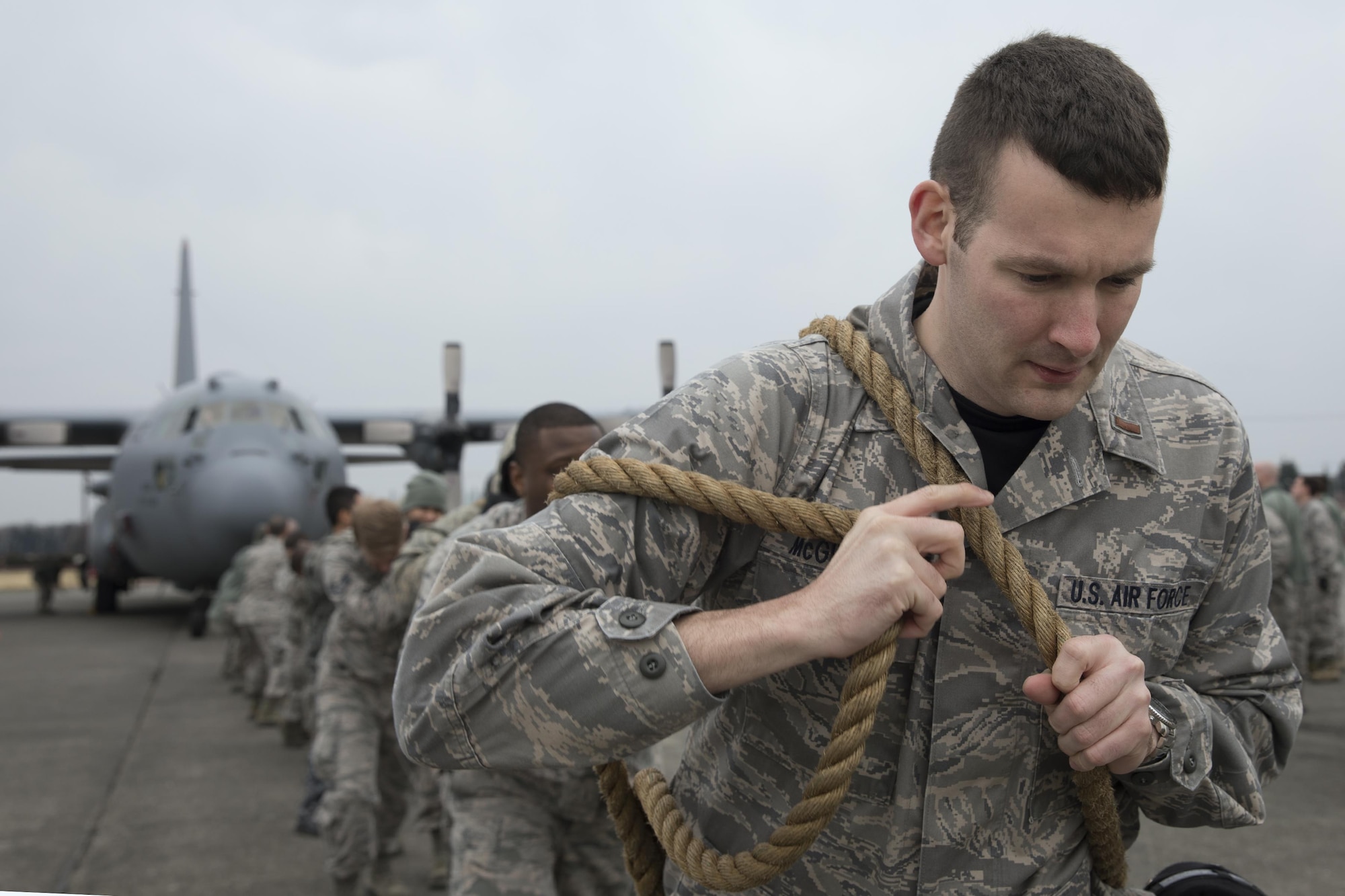 2nd Lt. Jarrett McGinness, 374th Aircraft Maintenance Squadron, prepares to pull a C-130H Hercules at Yokota Air Base, Japan, March 31, 2017. Yokota maintainers with the 374th AMXS, 374th Maintenance Squadron, 374th MXG, and 730th Air Mobility Squadron teamed up and participated in the rodeo which a variety of challenges: four-man pushups, leadership tool identification, maintenance relay race, Self Aid Buddy Care (SABC) timed event, vehicle push, towbar obstacle course, chock hold, blindfolded toolbox buildup, and a C-130H pull event. (U.S. Air Force photo by Yasuo Osakabe)