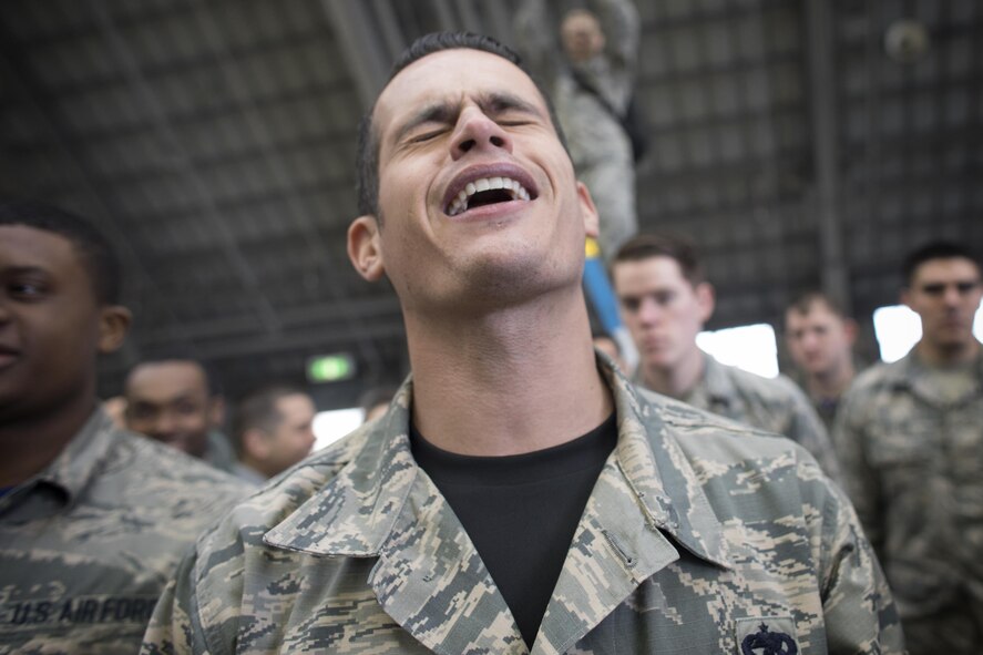 Staff Sgt. Christopher Rivera, 374th Aircraft Maintenance Squadron crew chief, gives sad expression during the annual 374th Maintenance Group Wrenchbender rodeo chock hold competition at Yokota Air Base, Japan, March 31, 2017. Trim is one of the finalist of the competition. The chock hold competition challenged Airmen to endure holding chocks up longer than opposing teams. A chock is a wedge placed against a wheel to prevent an aircraft from movement. (U.S. Air Force photo by Yasuo Osakabe)