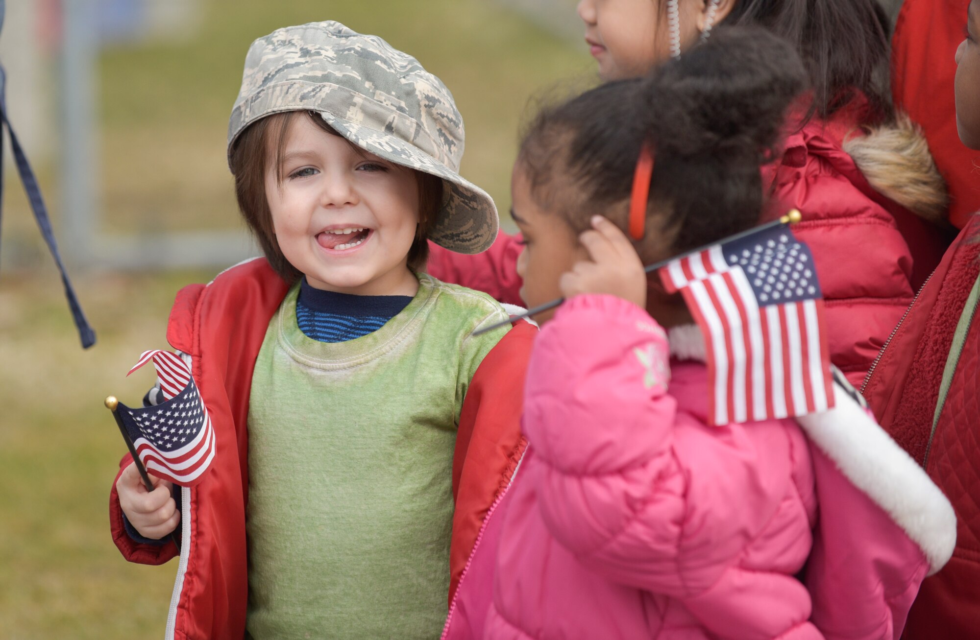 Children hold an American flag during Yoiko Child Development Center Month of the Military Child parade at Misawa Air Base, Japan, April 3, 2017. The children waved flags as they walked around the CDC building. (U.S. Air Force photo by Staff Sgt. Melanie A. Hutto)
