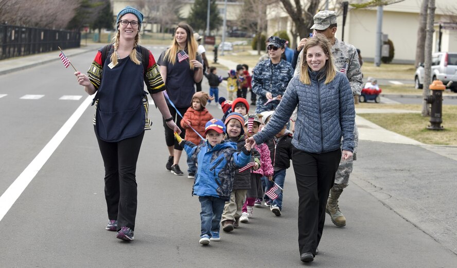 Children, parents and staff from the Yoiko Child Development Center walk in the Month of the Military Child parade at Misawa Air Base, Japan, April 3, 2017. The fire department, base honor guard and parents of the children partook in the parade. (U.S. Air Force photo by Staff Sgt. Melanie A. Hutto)
