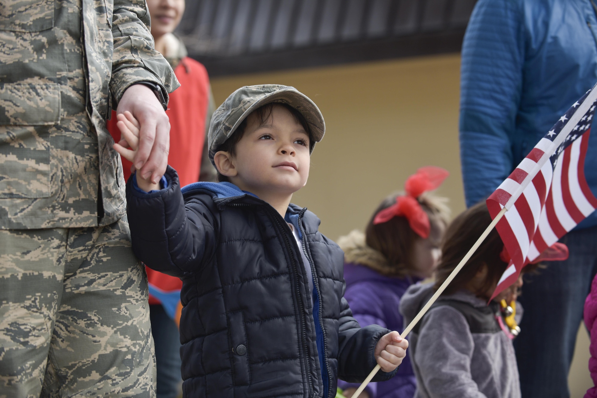 A young boy holds his father’s hand during Yoiko Child Development Center Month of the Military Child parade at Misawa Air Base, Japan, April 3, 2017. Established in 1986 by Caspar Weinberger, Secretary of Defense from 1981-1987, MOMC recognizes the contributions military children make as their parents serve. (U.S. Air Force photo by Staff Sgt. Melanie A. Hutto)