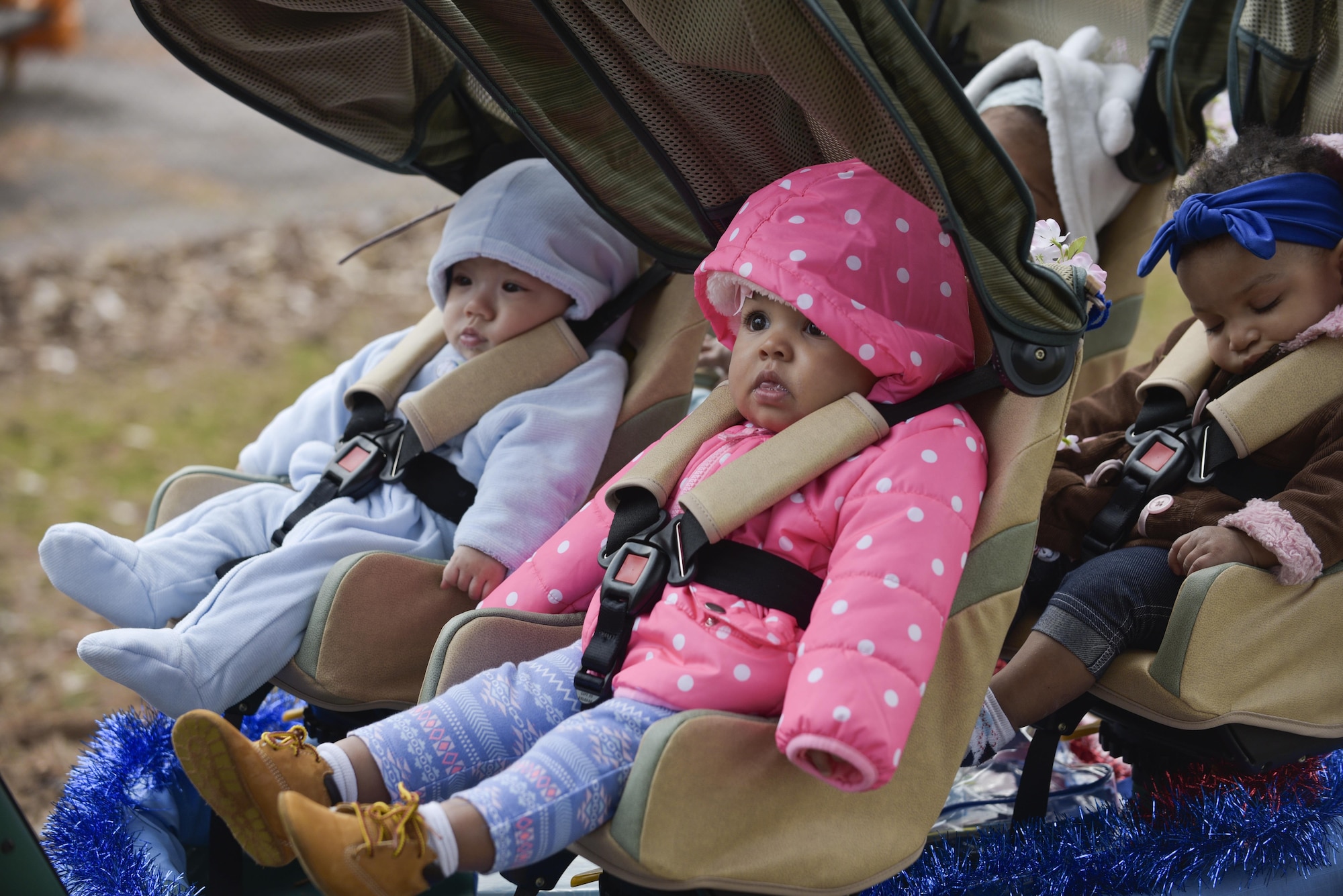 Infants sit in a stroller during Yoiko Child Development Center Month of the Military Child parade at Misawa Air Base, Japan, April 3, 2017. MOMC recognizes the contributions and sacrifices military children make as their parents serve. (U.S. Air Force photo by Staff Sgt. Melanie A. Hutto)