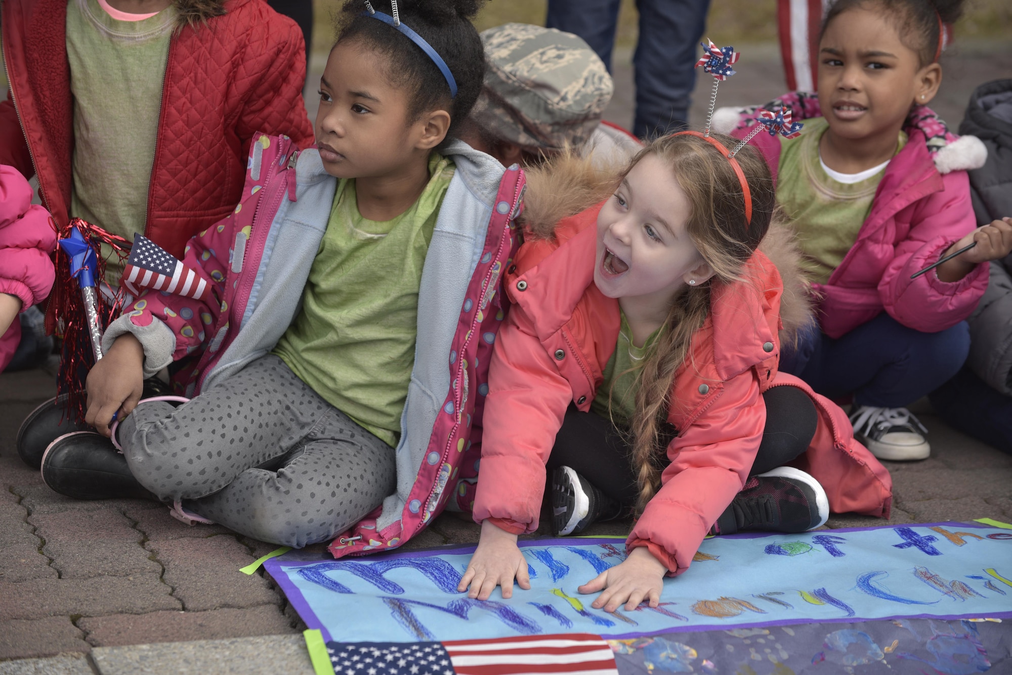 Children express excitement to see, the fire department mascot Sparky, after Yoiko Child Development Center Month of the Military Child parade at Misawa Air Base, Japan, April 3, 2017. The CDC will host events including Friday luncheons, making letters and pictures for deployed service members along with various spirit and themed days. (U.S. Air Force photo by Staff Sgt. Melanie A. Hutto)