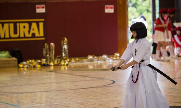 A Japanese child from the Shunan International Children’s Club demonstrates laido, an ancient Japanese martial art, with an imitation sword during the Japanese Cultural Exchange Program at Marine Corps Air Station Iwakuni, Japan, March 20, 2017. The Shunan International Children’s Club traveled to the air station to give the students an opportunity to experience Japanese singing, dancing and martial arts. (U.S. Marine Corps photo by Pfc. Stephen Campbell)
