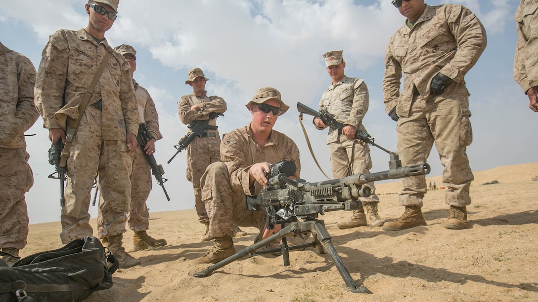 Lance Cpl. Alexander Seick, a communications specialist with Combat Logistics Battalion 11, 11th Marine Expeditionary Unit (MEU), closes the feed tray of an M240B medium machine gun after conducting a functions check during a sustainment training exercise near Camp Beuhring, Kuwait, March 5. Marines can use the M240B’s high rate of fire to provide suppressive fires, subduing enemy threats while moving toward an objective. The 11th MEU is currently supporting U.S. 5th Fleet’s mission to promote and maintain stability and security in the region.