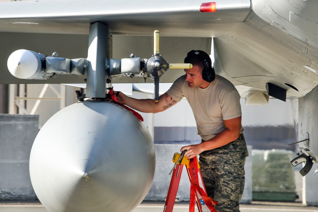 California Air National Guard Staff Sgt. Michael Foster pulls the pylon pins while performing end-of-runway checks on an F-15C Eagle during Sentry Aloha 17-03 at Joint Base Pearl Harbor-Hickam, Hawaii, March 30, 2017. Foster is a crew chief assigned to the California Air National Guard’s 44th Aircraft Maintenance Squadron. Air National Guard photo by Senior Master Sgt. Chris Drudge