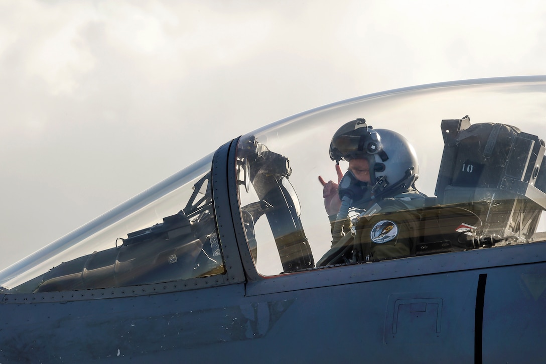 California Air National Guard Lt. Col. Robert Swertfager signals he is ready to taxi a F-15C Eagle during exercise Sentry Aloha 17-03 at Joint Base Pearl Harbor-Hickam, Hawaii, March 30, 2017. Swertfager is a pilot assigned to the California Air National Guard’s 194th Fighter Squadron. Air National Guard photo by Senior Master Sgt. Chris Drudge
