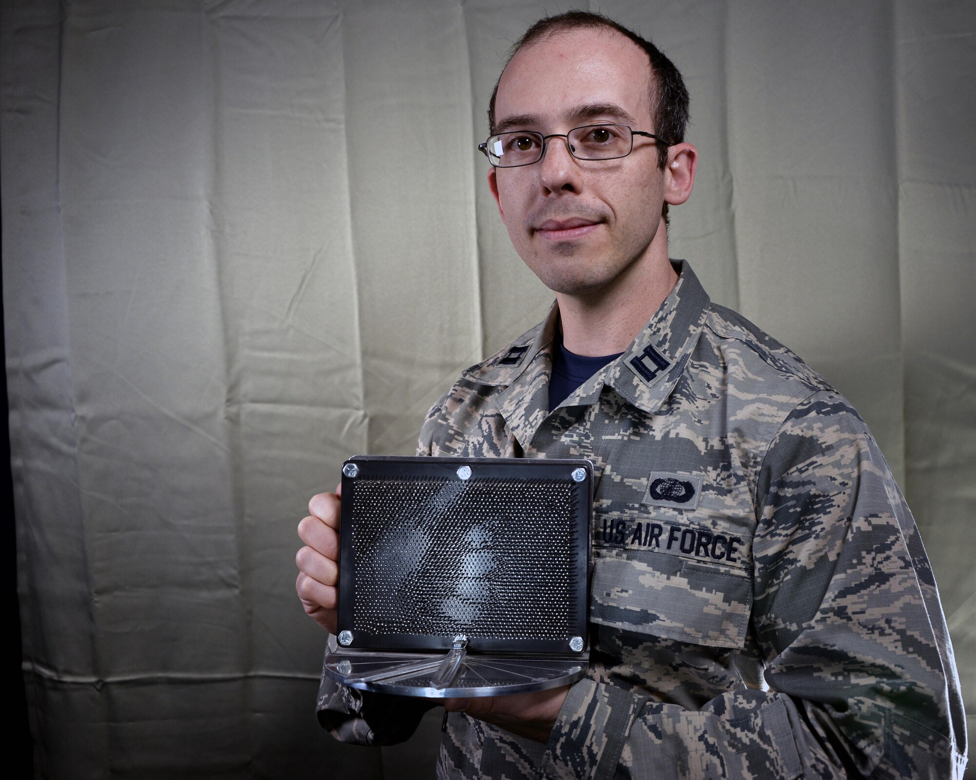 Capt. Daniel Stambovsky, a physicist assigned to the 32nd Intelligence Squadron at Fort Meade, Maryland, recently received notification that two of patents from his previous assignment at the Air Force Research Laboratory in Rome, New York, have been processed and approved: the “Actuated Pin Antenna Reflector” and the “Radio Frequency Emissive Display Antenna and System for Controlling.” (U.S. Air Force photo/Staff Sgt. Alexandre Montes)