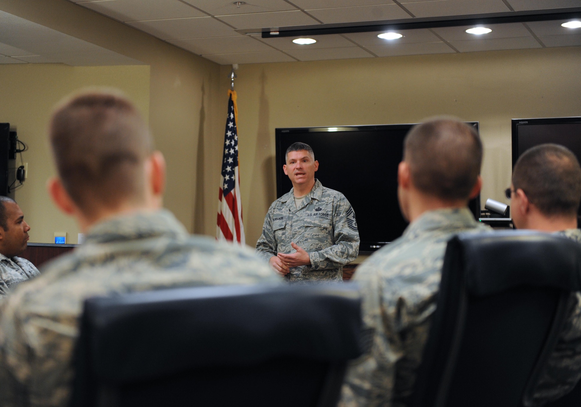 Chief Master Sgt. Patrick McMahon, U.S. Strategic Command senior enlisted leader, discusses various topics with Headquarters Eighth Air Force Airmen during a noncommissioned and senior noncommissioned officer all-call at Barksdale Air Force Base, La., April 3, 2017. Areas such as mission, professionalism, culture, leadership, and personal development were discussed in a question and answer format, allowing Eighth Air Force members to gain valuable insight. (U.S. Air Force photo by Senior Airman Erin Trower) 
