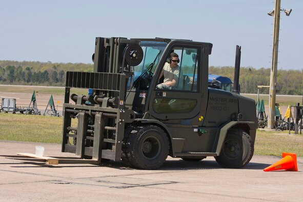 U.S. Air Force Reserve Tech Sgt. Danny Canup, air transportation craftsman, 96th Aerial Port Squadron, notices a flaw while operating a forklift during the Unit Training Assembly weekend April 1, 2017, at Little Rock Air Force Base, Ark. The 96 APS team is preparing to compete in the 2017 Port Dawg Challenge for air mobility professionals, and hopes to reclaim their 2012 title of “Top Dawg.” The title refers to the first place trophy. (U.S. Air Force photo by Master Sgt. Jeff Walston/Released)