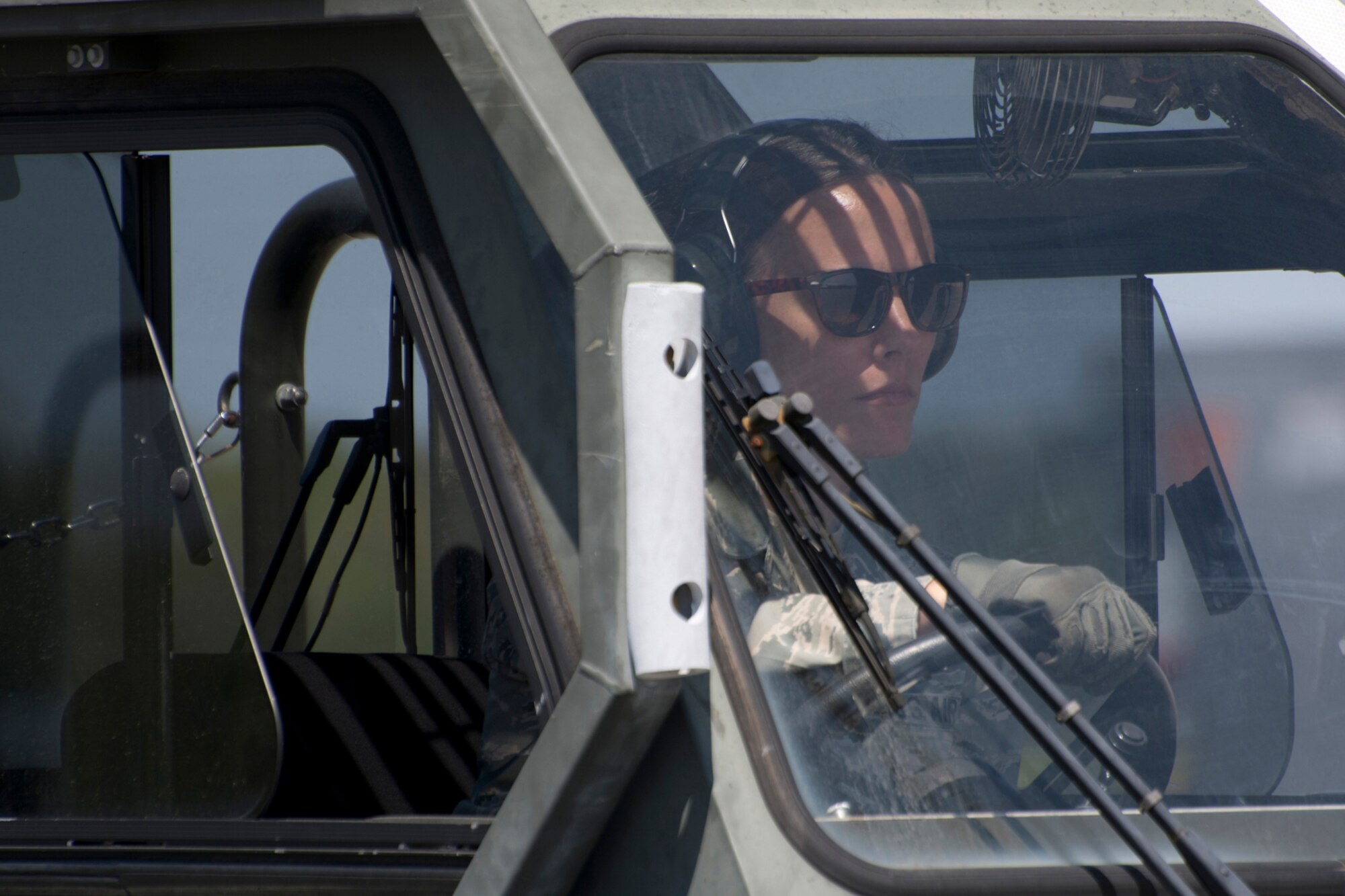 U.S. Air Force Reserve Tech Sgt. Kristen Garrett, air transportation craftsman, 96th Aerial Port Squadron,   practices driving a Halverson 25K Loader during her Unit Training Assembly weekend April 1, 2017, at Little Rock Air Force Base, Ark. Garrett is preparing to compete in the 2017 Port Dawg Challenge for air mobility professionals at Dobbins Air Reserve Base, Ga. (U.S. Air Force photo by Master Sgt. Jeff Walston/Released)