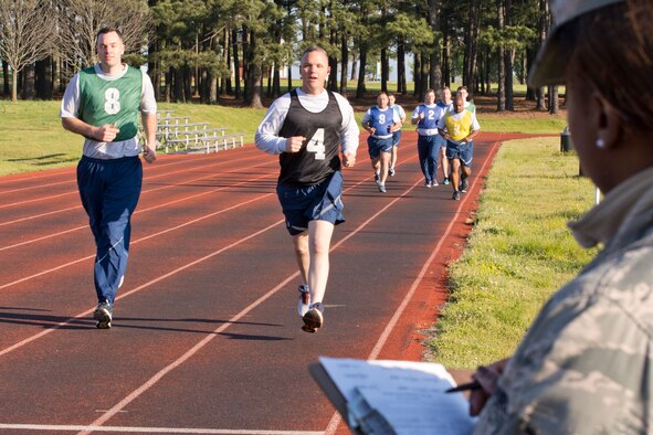 U.S. Air Force Reserve Tech Sgt. Brittney Johnson, command support staff, 913th Maintenance Squadron, monitors and records scores for fellow Airmen as they complete the run portion of their physical fitness assessment test April 1, 2017, at Little Rock Air Force Base, Ark. Many Airmen push themselves to score 90 or above, which allows them to test annually, rather than biannually. (U.S. Air Force photo by Master Sgt. Jeff Walston/Released)
