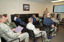 U.S. Air Force Reserve Tech Sgt. Robert Porras, customer service supervisor, 913th Force Support Squadron, conducts a briefing for 913th Airlift Group newcomers during the Unit Training Assembly weekend April 1, 2017, at Little Rock Air Force Base, Ark. All newcomers receive an orientation that covers rules and regulations, expectations and where members can go for work related assistance. (U.S. Air Force photo by Master Sgt. Jeff Walston/Released)
