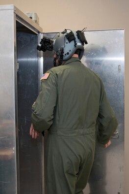 U.S. Air Force Reserve Lt. Col. Dan Collister, evaluator pilot, 327th Airlift Squadron, prepares to focus a pair of night vision goggles (NVG) in a Hoffman ANV 20/20 test system April 1, 2017, at Little Rock Air Force Base, Ark. Before flying operations, aircrews must pre-focus and adjust their NVG objective lenses at optical infinity before boarding the aircraft. (U.S. Air Force photo by Master Sgt. Jeff Walston/Released)