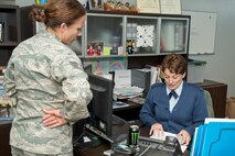 U.S. Air Force Reserve Tech Sgt. Kristen Garrett, an air transportation craftsman assigned to the 96th Aerial Port Squadron, turns in paperwork to Tech Sgt. Jacqueline Langston, unit training manager, 96 APS, to have the 25K Loader added to her military driver’s license April 1, 2017, at Little Rock Air Force Base, Ark. Garrett is preparing to compete in the 2017 Port Dawg Challenge for air mobility professionals. (U.S. Air Force photo by Master Sgt. Jeff Walston/Released)