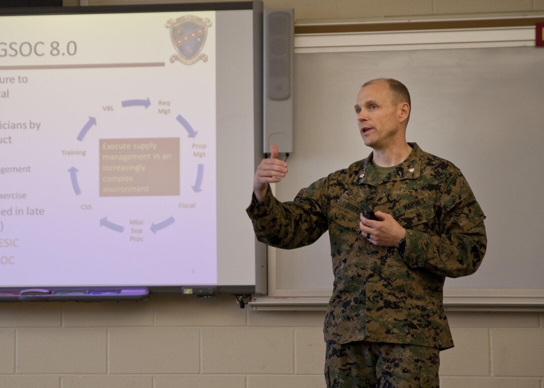 U.S. Marine Corps Lt. Col. Douglas Burke, commanding officer of Ground Supply School, Marine Corps Combat Service Support Schools (MCCSSS), briefs Marines from MCCSSS and Brig. Gen. Jason Q. Bohm, commanding general of Training Command, during Bohm's visit to Camp Johnson, N.C., March 1, 2017. Brig. Gen. Bohm's visit was to observe and discuss how MCCSSS' plans nest with the Training Command Campaign Plan and to review progress on the Leadership Development Program, reading and writing programs, and employment of Force Fitness Instructors. (U.S. Marine Corps photo by Cpl. Laura Mercado)