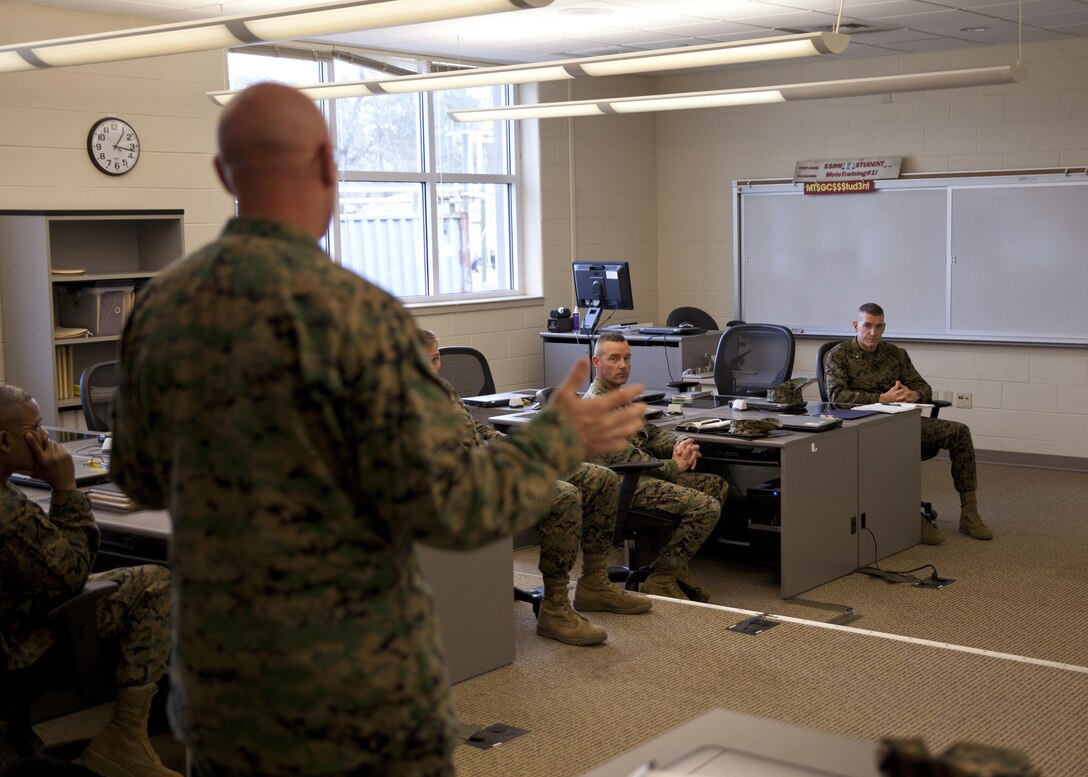 U.S. Marine Corps Lt. Col. Keith Warren, commanding officer of Logistics Operations School, Marine Corps Combat Service Support Schools (MCCSSS), briefs Marines from MCCSSS and Brig. Gen. Jason Q. Bohm, commanding general of Training Command, during Bohm's visit to Camp Johnson, N.C., March 1, 2017. Brig. Gen. Bohm's visit was to observe and discuss how MCCSSS' plans nest with the Training Command Campaign Plan and to review progress on the Leadership Development Program, reading and writing programs, and employment of Force Fitness Instructors. (U.S. Marine Corps photo by Cpl. Laura Mercado)