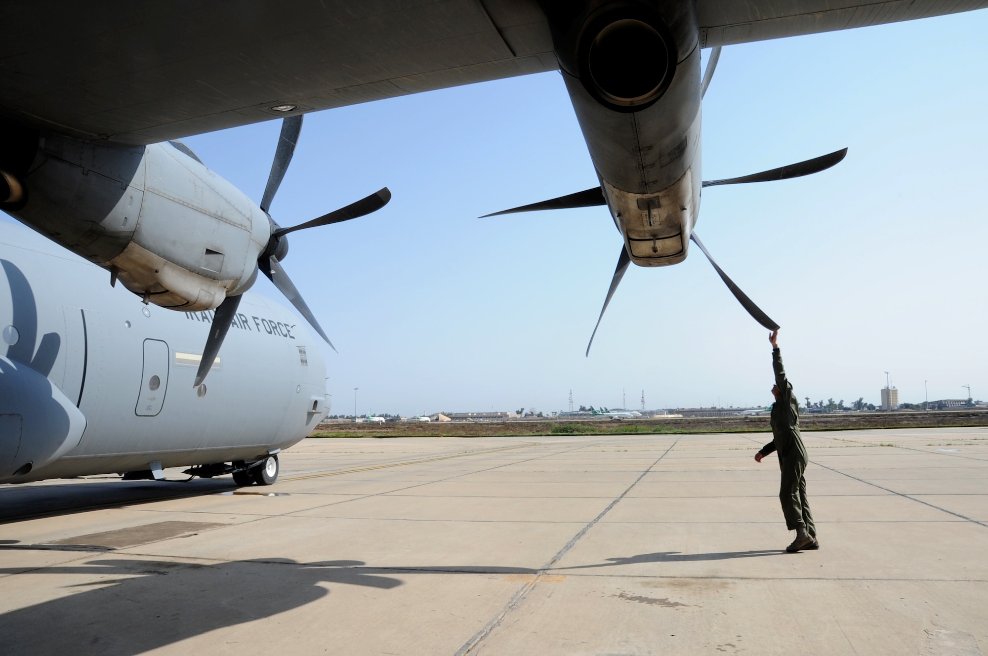 Iraqi Air Force Maj. Diya Majid, pilot, inspects a C-130J Super Hercules propeller March 20, 2017 at Martyr Muhammad Alaa Air Base, Iraq. The aircraft is used by the Iraqi Air Force to move cargo and personnel downrange in the fight against ISIS. (U.S. Air Force photo/Tech. Sgt. Kenneth McCann)