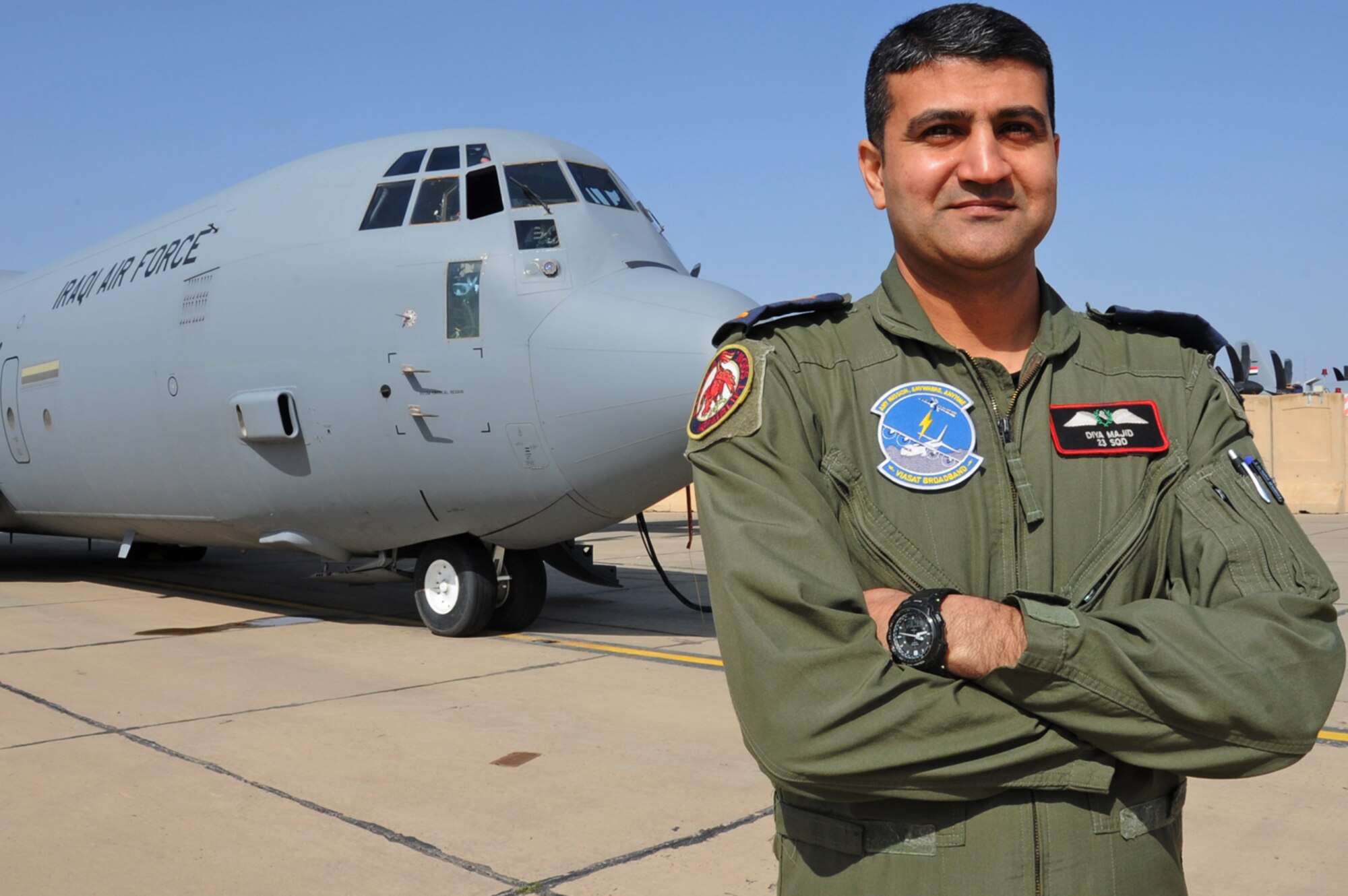 Iraqi Air Force Maj. Diya Majid, pilot, stands in front of a C-130J Super Hercules March 20, 2017 at Martyr Muhammad Alaa Air Base, Iraq. Majid trains with the 370th  Air Expeditionary Advisory Squadron to improve his knowledge of the aircraft. (U.S. Air Force photo/Tech. Sgt. Kenneth McCann)
