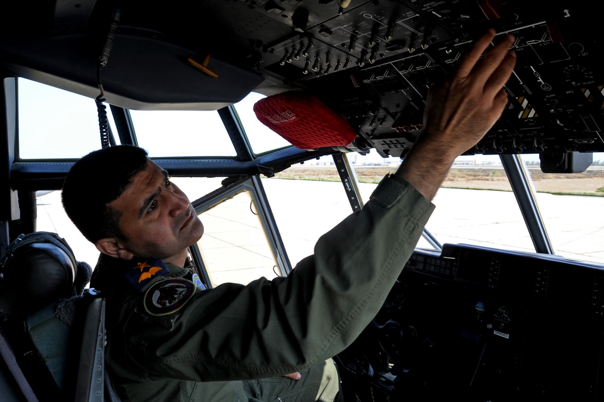 Iraqi Air Force Maj. Diya Majid, pilot, performs pre-flight inspections on a C-130J Super Hercules at Martyr Muhammad Alaa Air Base, Iraq, March 20 2017. Majid trains with the 370th  Air Expeditionary Advisory Squadron to improve his knowledge of the aircraft. (U.S. Air Force photo/Tech. Sgt. Kenneth McCann)