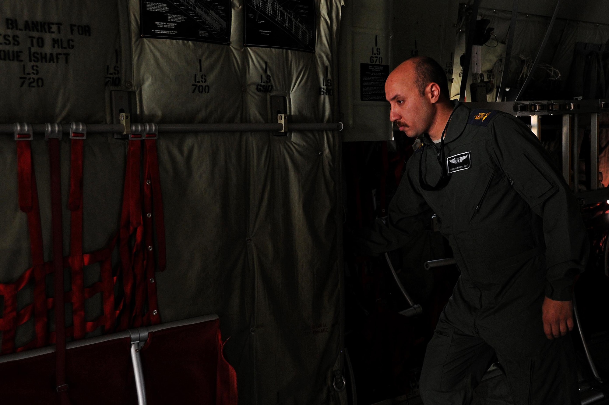 Iraqi Air Force Maj. Samar Kamal, loadmaster, inspects a C-130J Super Hercules at Martyr Muhammad Alaa Air Base, Iraq, March 20, 2017. Kamal is responsible for on-loading and off-loading of the aircraft.  (U.S. Air Force photo/Tech. Sgt. Kenneth McCann)