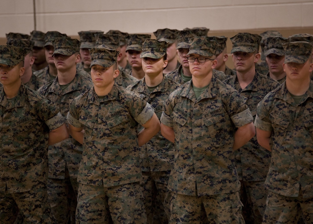 U.S. Marine Corps Pfc. Maria Daume, center, a mortarman assigned to Bravo Company, Infantry Training Battalion, School of Infantry-East,  graduates from the Basic Mortarman course aboard Camp Geiger, N.C., March 23, 2017. The purpose of the Mortarman is to provide fire in support of maneuver elements using light, medium, and heavy mortars. (U.S. Marine Corps photo by Cpl. Laura Mercado)