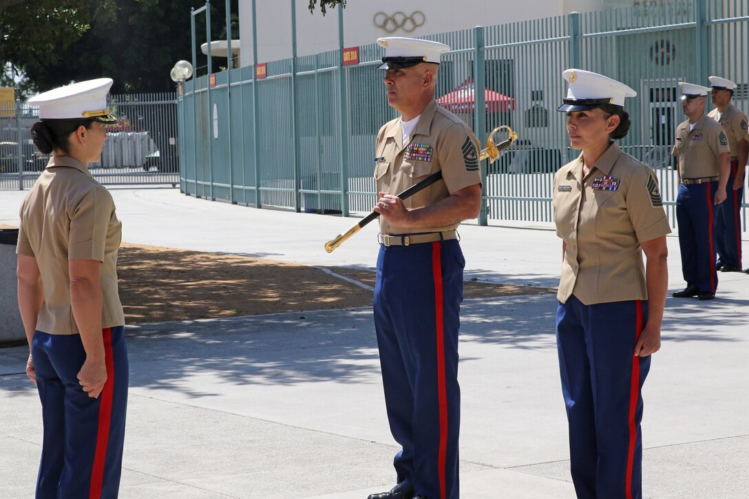 Sgt. Maj. Johnpaul Doring relinquishes his post as the sergeant major of Recruiting Station Los Angeles to Sgt. Maj. Christina E. Hunts Horse-May during a relief and appointment ceremony at the Los Angeles Memorial Coliseum in California, March 24, 2017.
