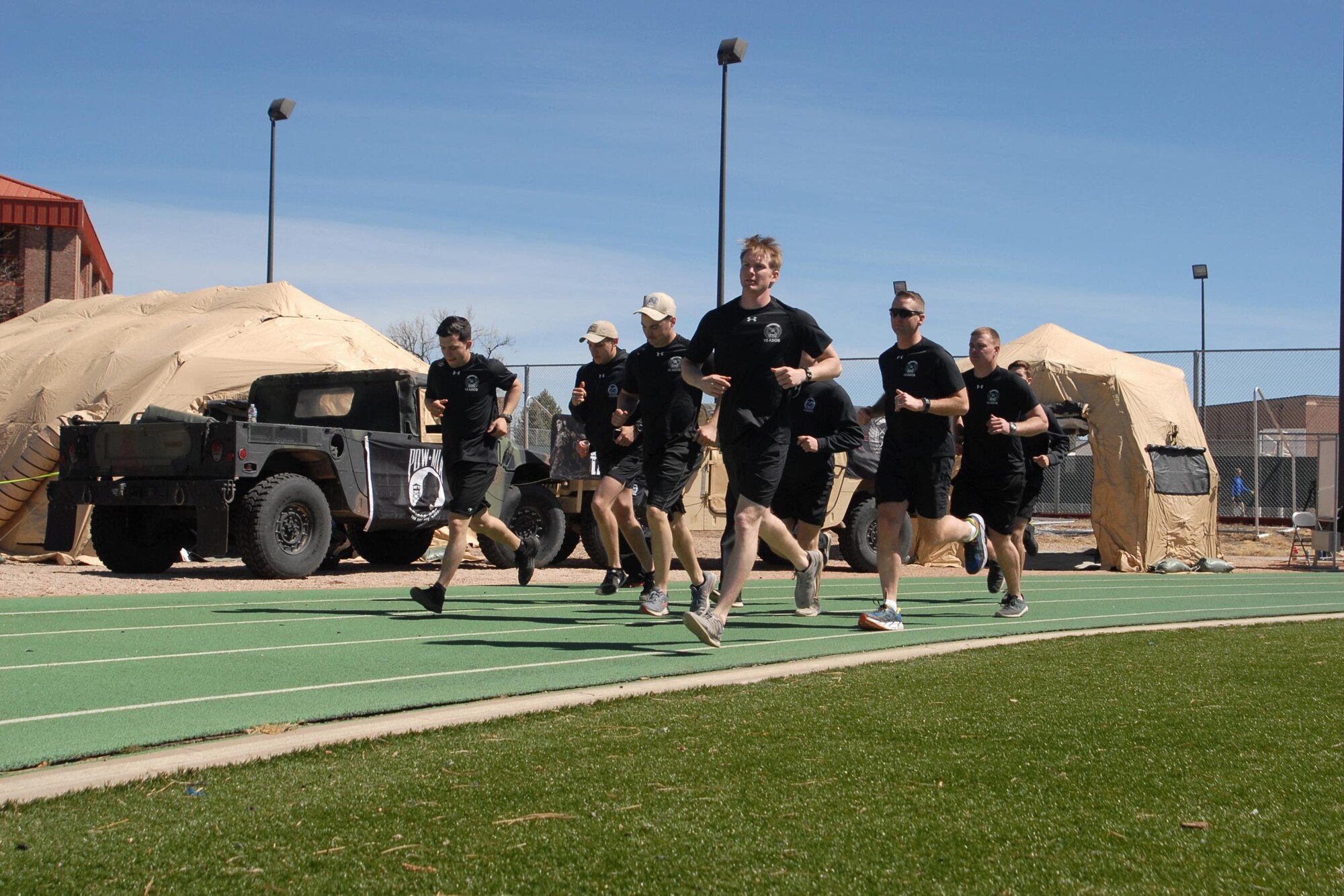 PETERSON AIR FORCE BASE, Colo. — Members of the 13th Air Support Operations Squadron kick off the sixth annual 24-Hour Challenge run at Peterson Air Force Base, Colo., March 30, 2017. The run is done around the world to honor fallen Tactical Air Control Party Airmen and raise money to help members of the TACP community and their families. (U.S. Air Force photo by Shellie-Anne Espinosa)