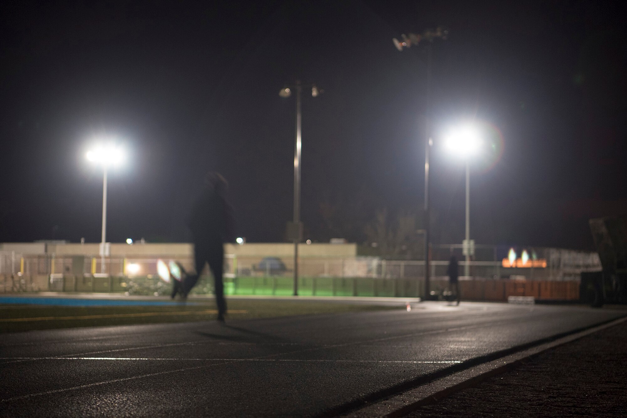 PETERSON AIR FORCE BASE, Colo. – Members of the 13th Air Support Operations Squadron run around the track at midnight during the 24-Hour Challenge run at Peterson Air Force Base, Colo., March 31, 2017. The run is done annually around the world to honor fallen Tactical Air Control Party Airmen and raise money to help members of the TACP community and their families. (U.S. Air Force photo by Steve Kotecki)