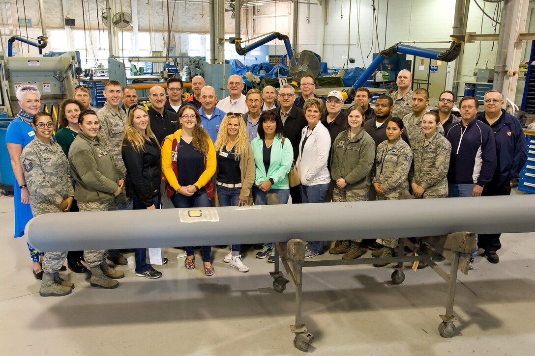 Team Dover Honorary Commanders pose for a photo at the 436th Maintenance Squadron Fabrication Flight March 29, 2017, on Dover Air Force Base, Del. Twenty-three honorary commanders received mission briefings, toured various 436th Maintenance Group facilities, visited with Team Dover members and participated in hands-on demonstrations. (U.S. Air Force photo by Roland Balik)