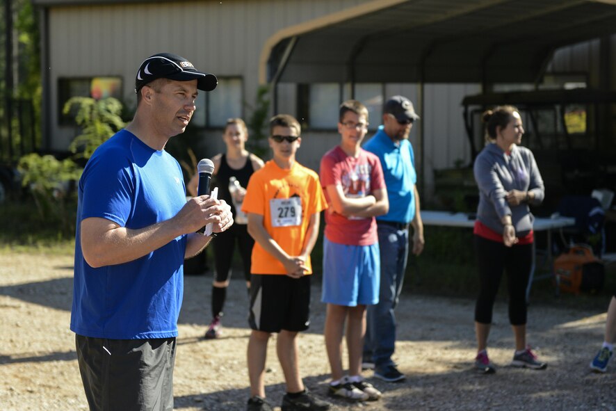 Col. Ty Neuman, 2nd Bomb Wing commander, gives opening remarks to participants during the 2017 Defenders of Liberty Mud Run at Barksdale Air Force Base, La., April 1. The event was open to the public and featured four miles of extreme trail running through Barksdale’s East Reservation. (U.S. Air Force photo/Senior Mozer O. Da Cunha)