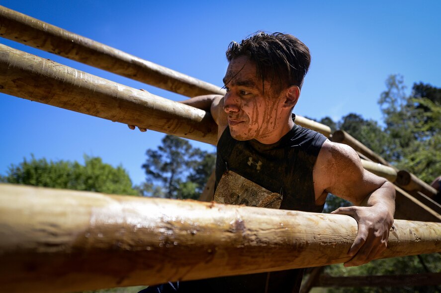 A contestant progresses through the course during the 2017 Defenders of Liberty Mud Run at Barksdale Air Force Base, La., April 1. The course offered a variety of obstacles designed to challenge competitors’ skills, strength and endurance over four miles of tough terrain. (U.S. Air Force photo/Senior Airman Mozer O. Da Cunha)
