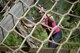 Izabela Carabelli, a participant, climbs an obstacle during the 2017 Defenders of Liberty Mud Run at Barksdale Air Force Base, La., April 1. The course was revised from previous years, adding, moving and rotating obstacles to give participants a fresh challenge. (U.S. Air Force photo/Senior Mozer O. Da Cunha)