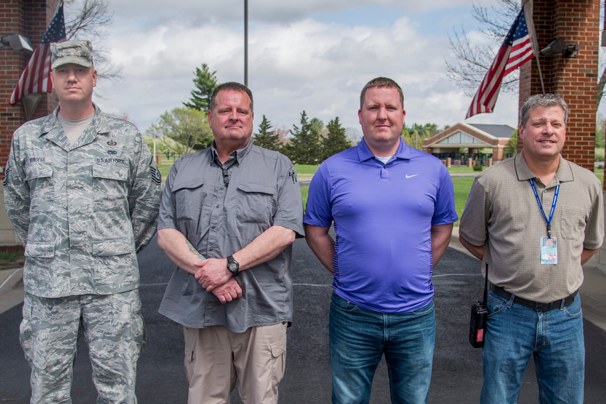 (Left to Right) Master Sgt. Michael Burgess, 932nd Air Wing occupational safety manager, Jim Binford, 375th Safety Office occupational safety manager, Anthony Mckee, 375th Safety Office occupational safety manager, and T.J. Miles, 375th Medical Group occupational safety manager pose for a photo outside of the Scott Event Center April 4, 2017. The Team Scott members assisted a man in a vehicle accident on their way home from St. Louis March 15. (U.S. Air Force photo by Airman Chad Gorecki)