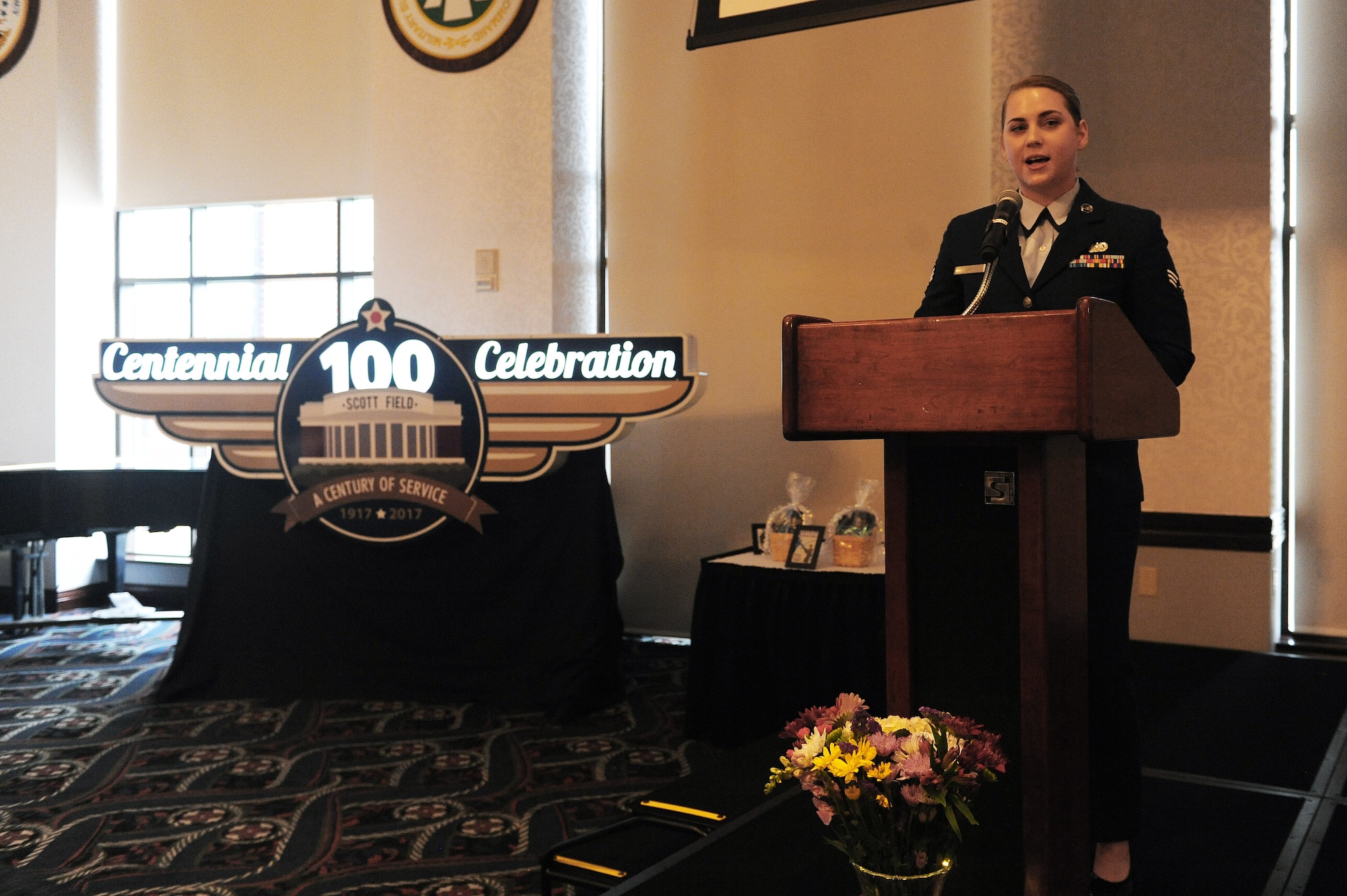 Senior Airman Sarah Lay, 375th Air Mobility Wing Legal Office military  justice paralegal, emcees a women's history luncheon at the Scott Event Center March 29. With a theme of, "Honoring Trailblazing Women in the Military," the event focused on female service members and the obstacles they had to overcome. (U.S. Air Force photo by Tech. Sgt. Maria Castle)