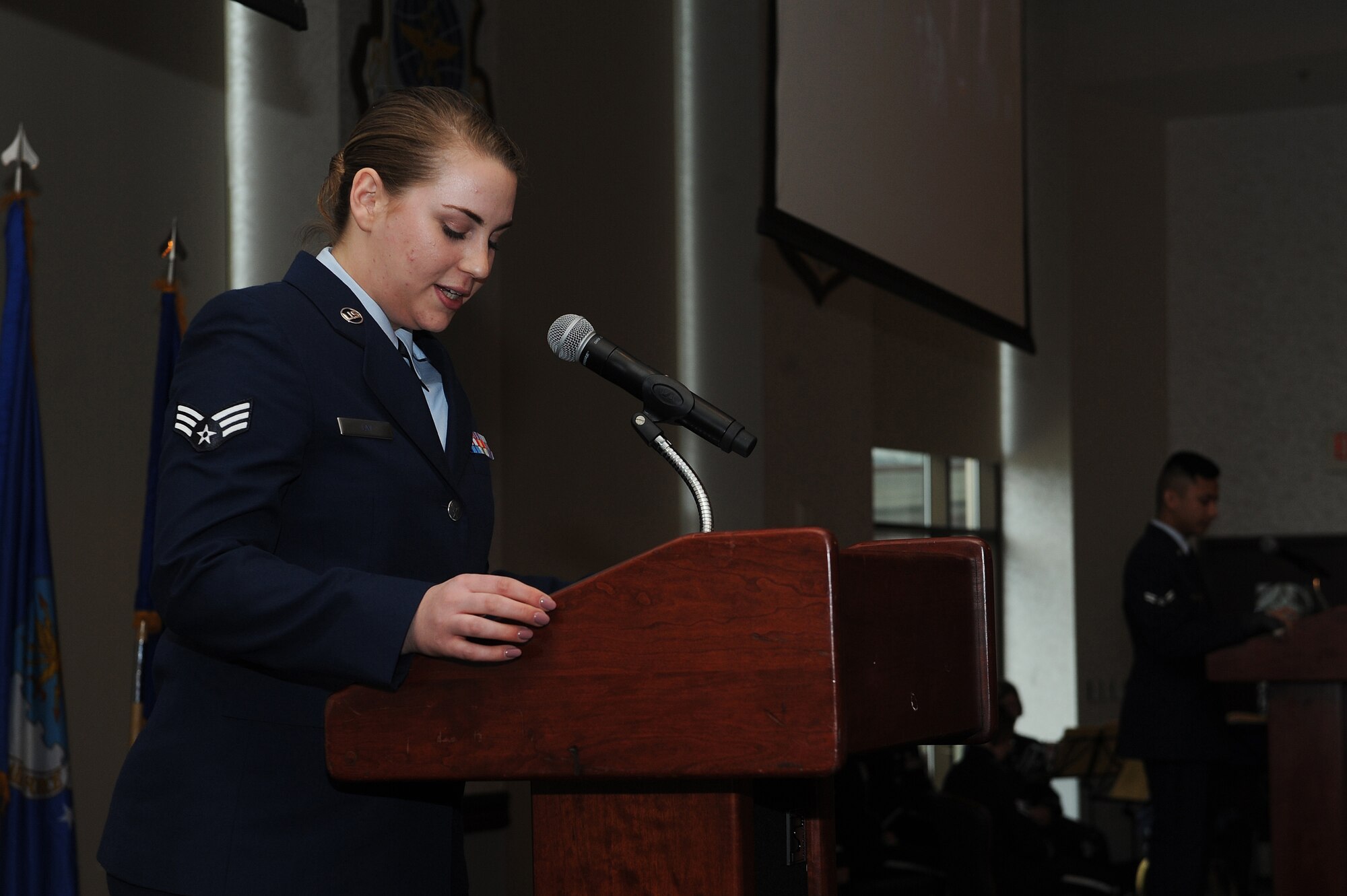 Senior Airman Sarah Lay, 375th Air Mobility Wing Legal Office military  justice paralegal, emcees a women's history luncheon at the Scott Event Center March 29. With a theme of, "Honoring Trailblazing Women in the Military," the event focused on female service members and the obstacles they had to overcome. (U.S. Air Force photo by Tech. Sgt. Maria Castle)