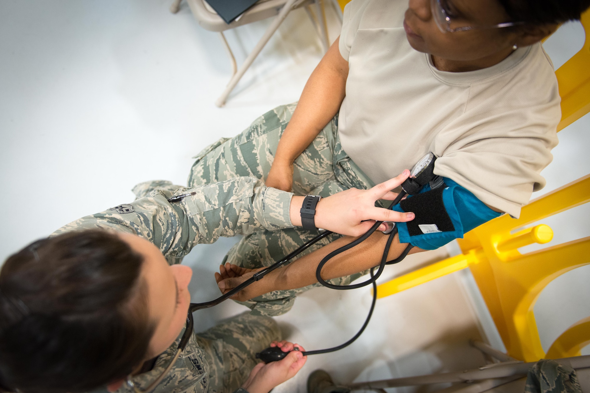 Airman 1st Class Julia Matthews, 934th ASTS medical technician, takes the blood pressure of Senior Airman Delonda Ward, of the 96 AS orderly room, during her annual physical on April 2. 