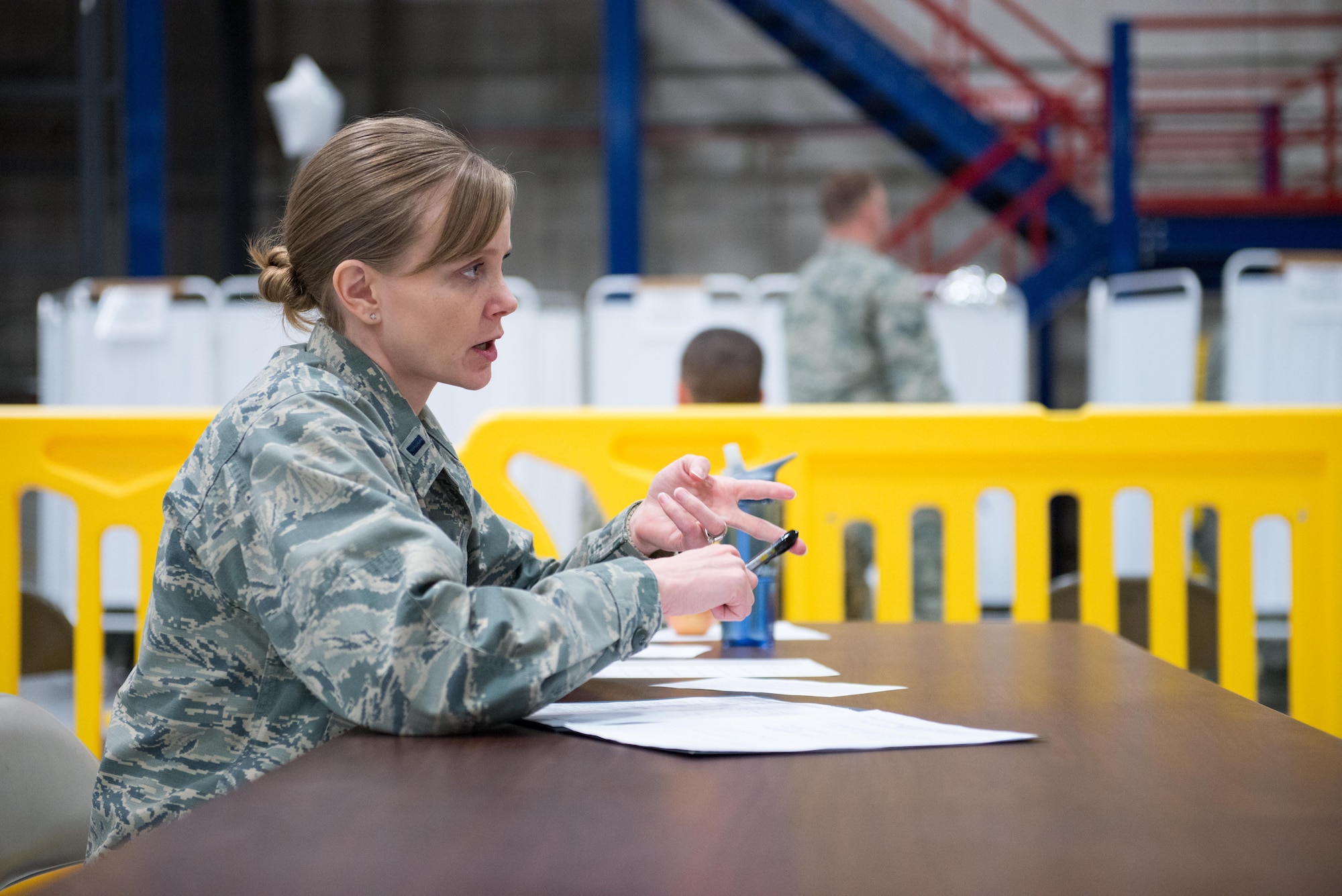 1st Lt. Kristy Saylor, 934th ASTS clinical nurse, speaks to a member during the annual mass physicals on April 2. 