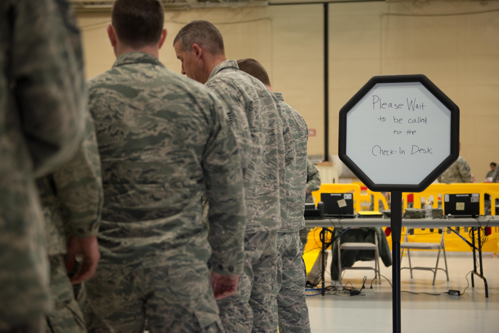 Members of the 934th Airlift Wing wait their turn for mass physicals at the fuel cell hangar on April 2. 