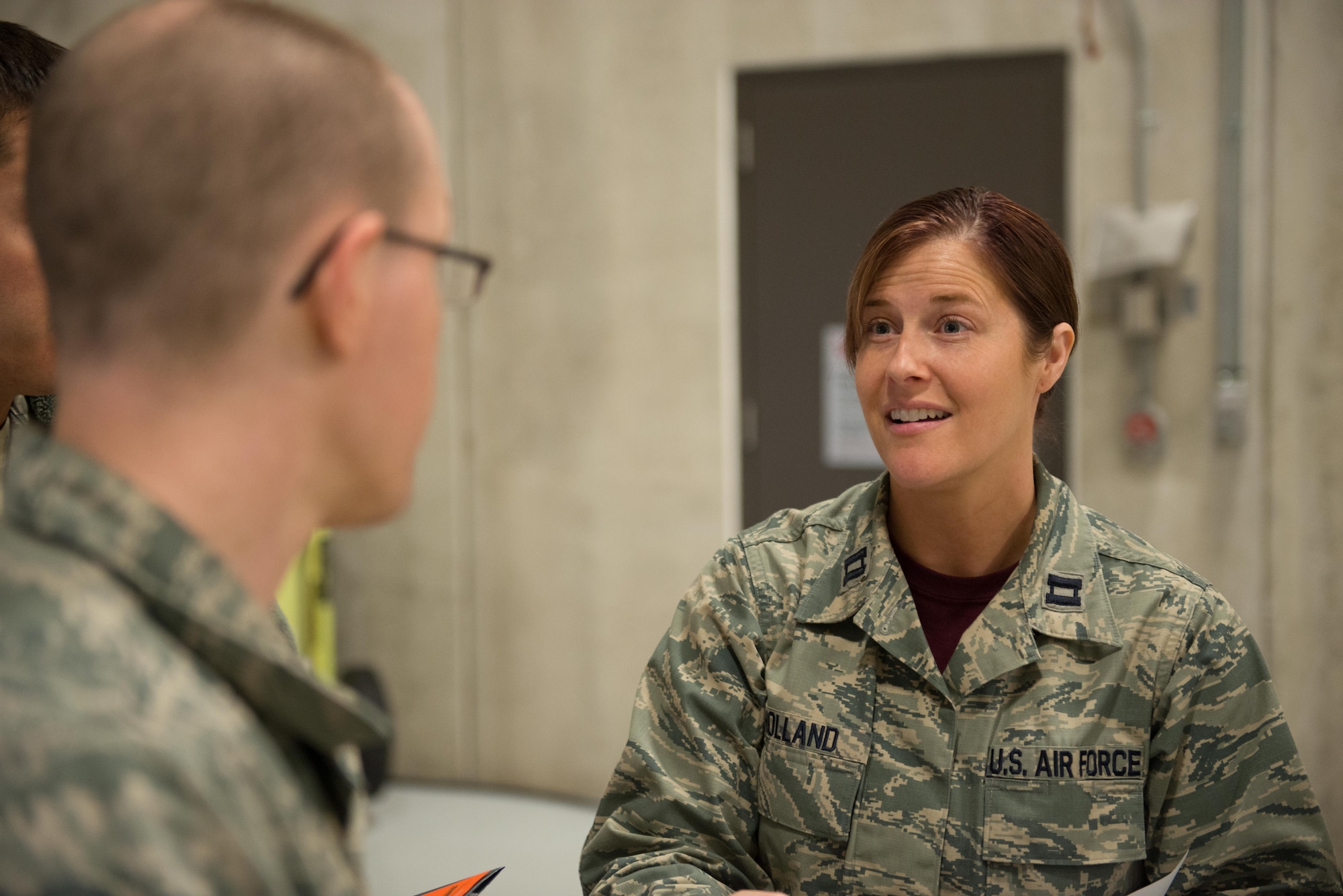Captain Janelle Holland speaks to members of the 934th Airlift Wing prior to their annual physicals on April 2.