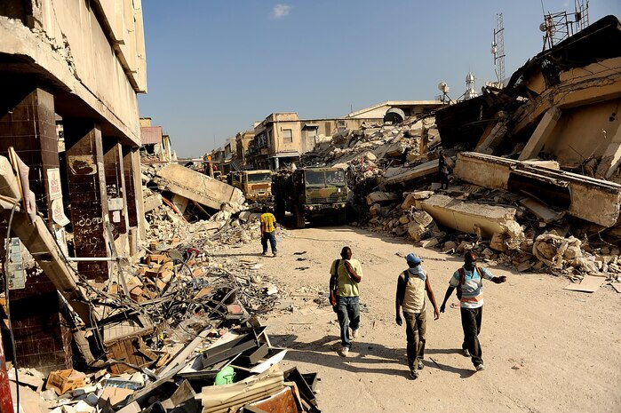 U.S. Army Soldiers from Bravo Company, 2nd Battalion, 325th Airborne Infantry Regiment, 2nd Brigade Combat Team, 82nd Airborne Division, Fort Bragg, NC, convoy back to the Troussaint Louverture International Airport, Haiti after  delivering earthquake relief (food and water) to the local Haitians on January 22, 2010 in Port au Prince, Haiti for Operation Unified Response. The soldiers delivered 300 Humanitarian Daily Rations and 600 bottles of water on this trip. A devastating earthquake hit the region on January 12, 2010. This photograph was provided by the 1st Combat Camera Squadron to showcase world events they have documented throughout the past 25 years.
